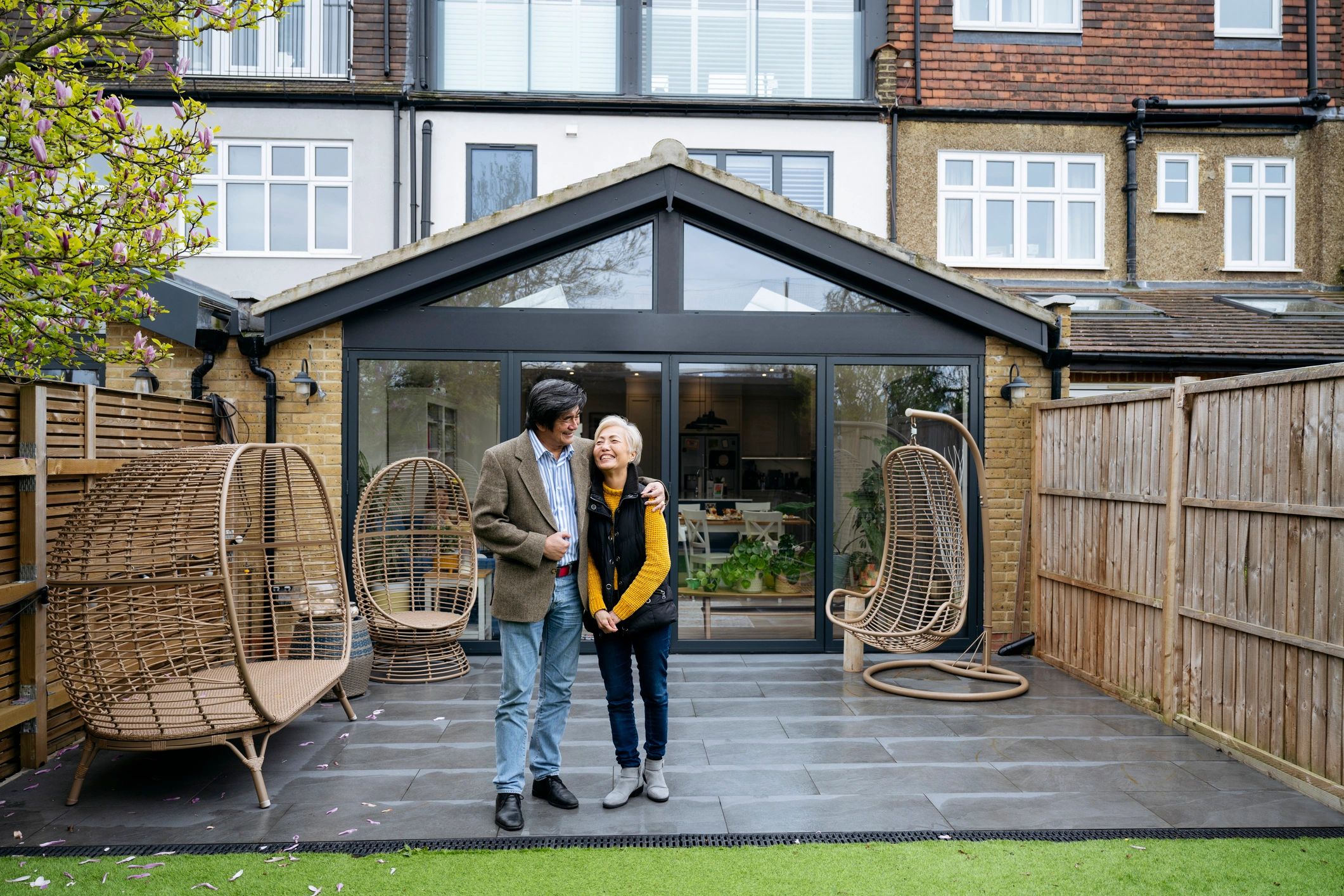 Homeowners standing together on a modern patio